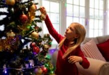 Ó szép műfenyő, oly kedves minden ágad! Girl at home at Christmas time