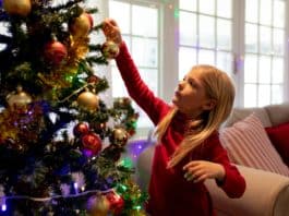 Ó szép műfenyő, oly kedves minden ágad! Girl at home at Christmas time