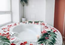 Bathroom decorated with branches and rose petals